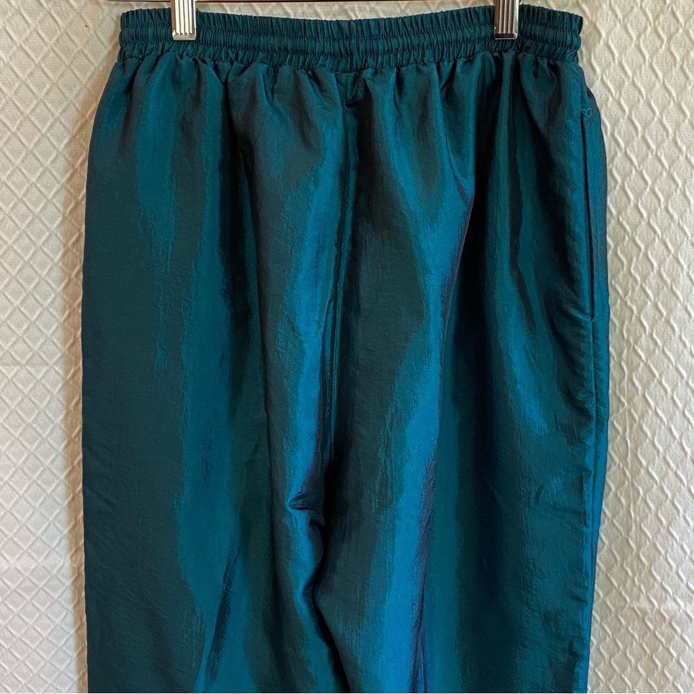 80’s style shiny emerald green wind breaker pants. Zippers on bottom cuffs. M.